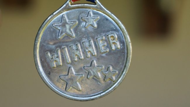 A medal that says winner.